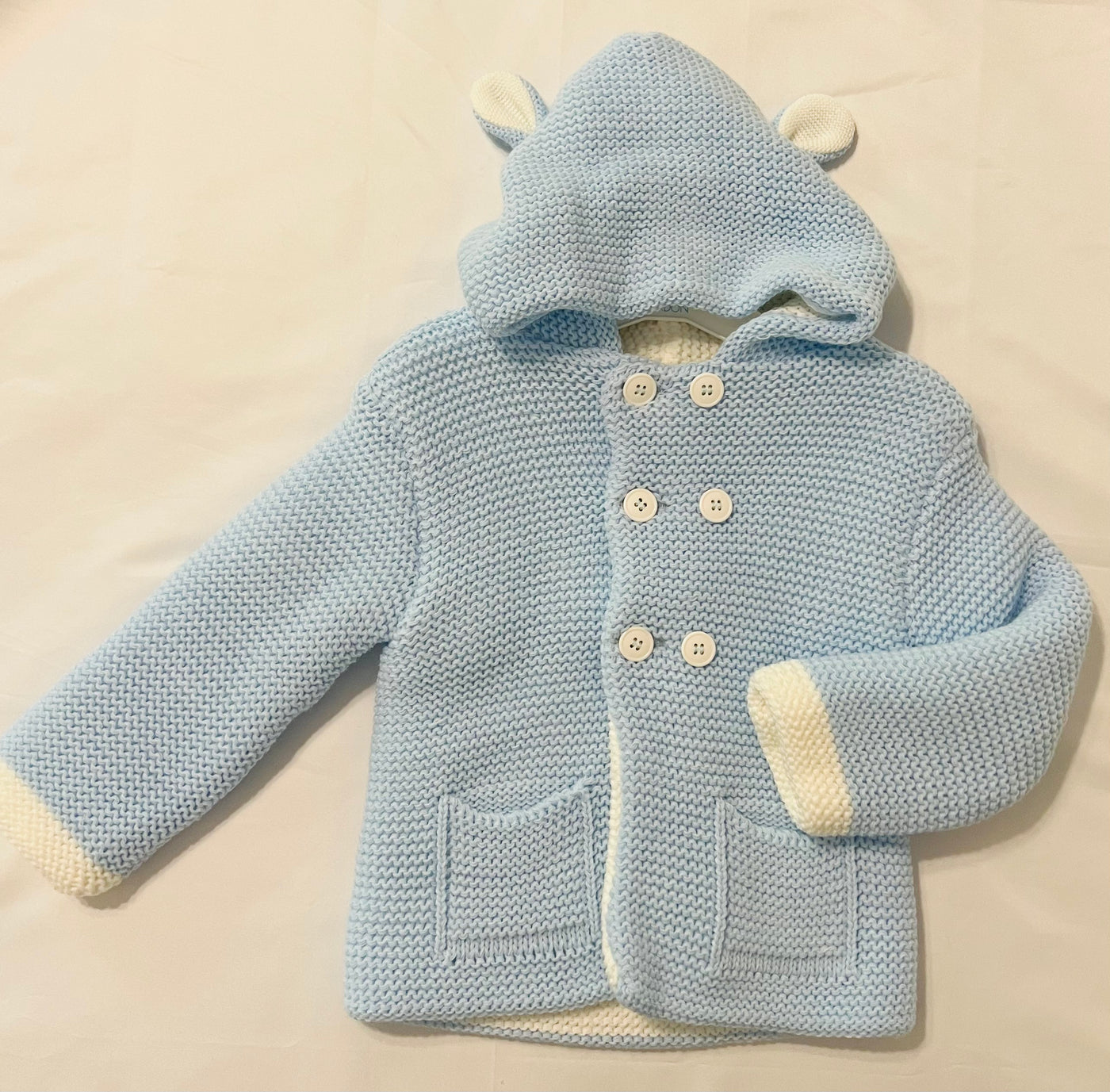 Blue knitted jacket with hoodie
